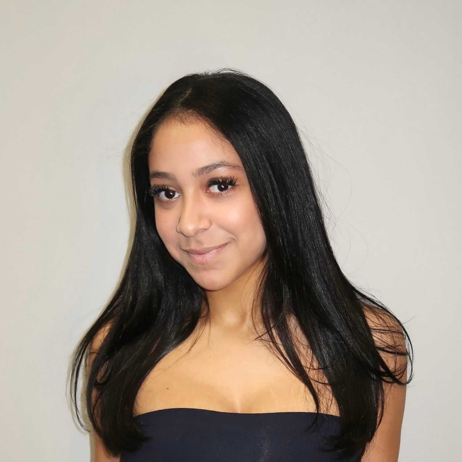 Portrait of Jada, a professional stylist at Illusions Salon & Spa, showcasing their expertise and style.