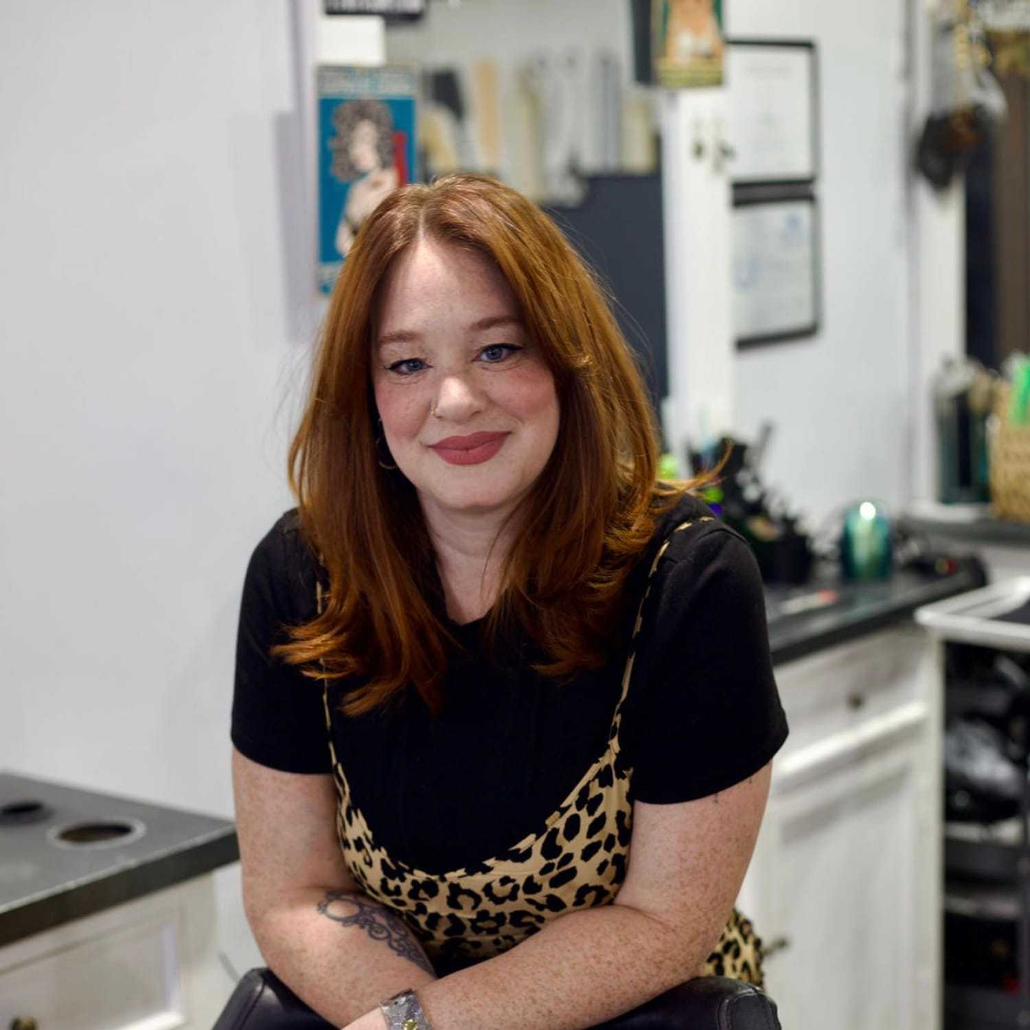 Portrait of Robin, a professional stylist at Illusions Salon & Spa, showcasing their expertise and style.