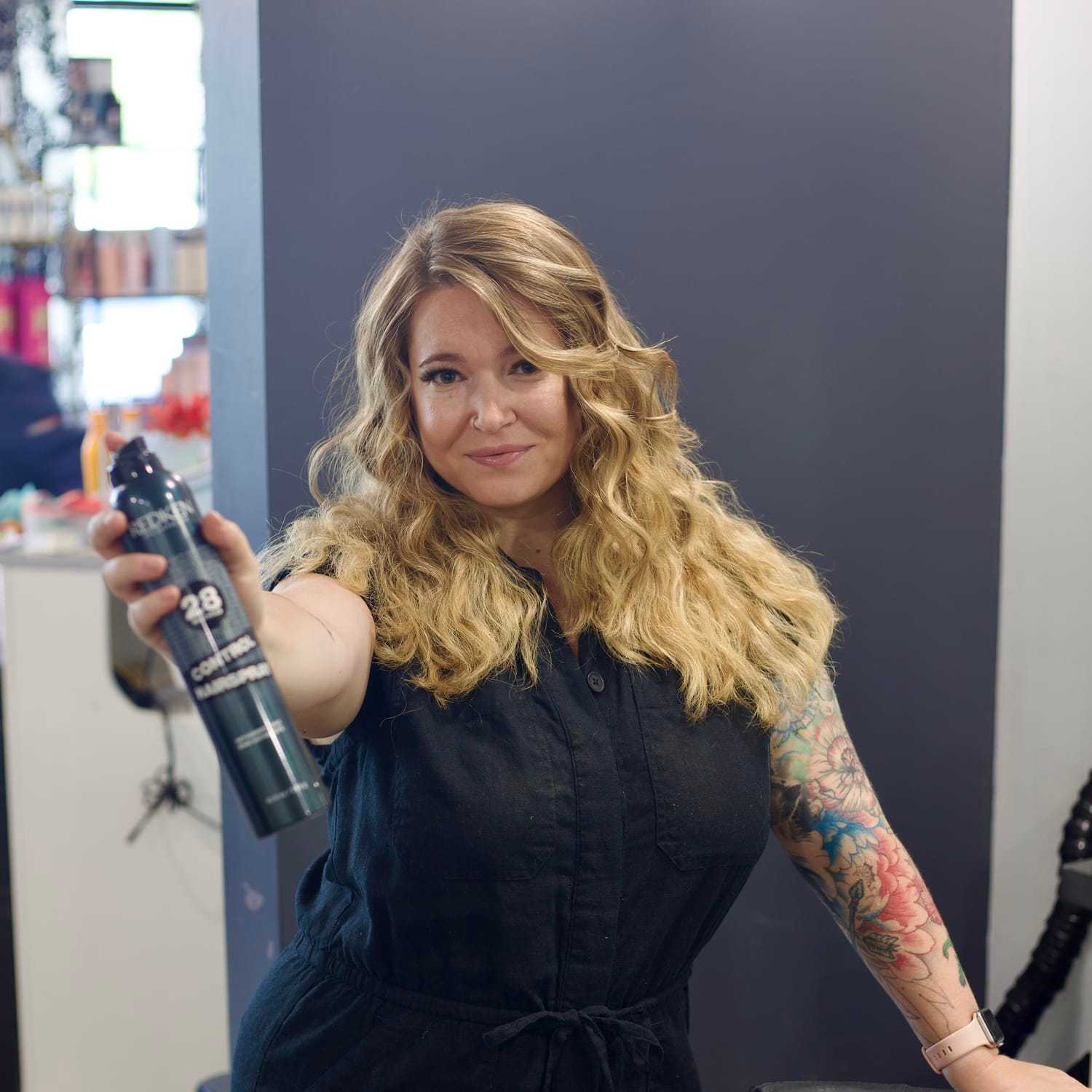 Portrait of Ariel, a professional stylist at Illusions Salon & Spa, showcasing their expertise and style.