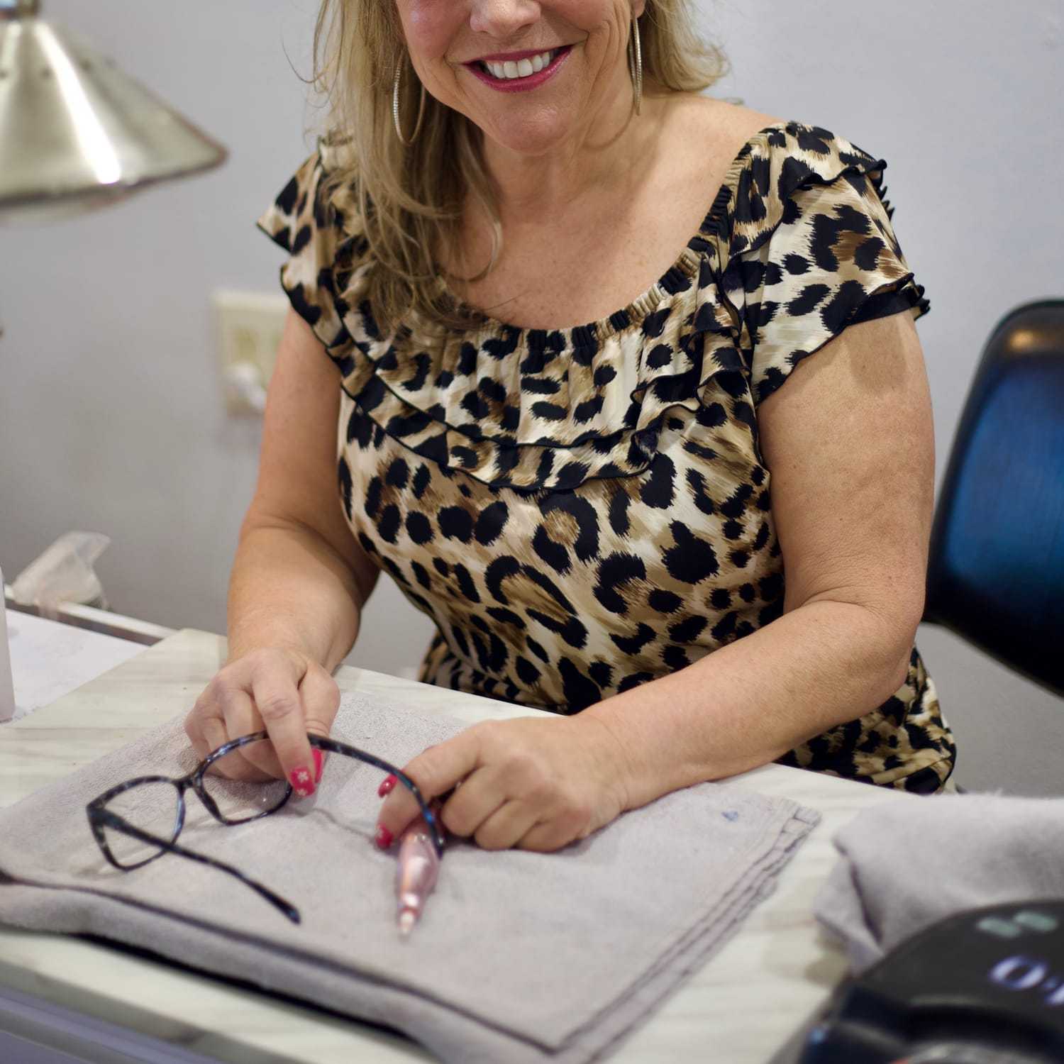 Portrait of Kim, a professional stylist at Illusions Salon & Spa, showcasing their expertise and style.