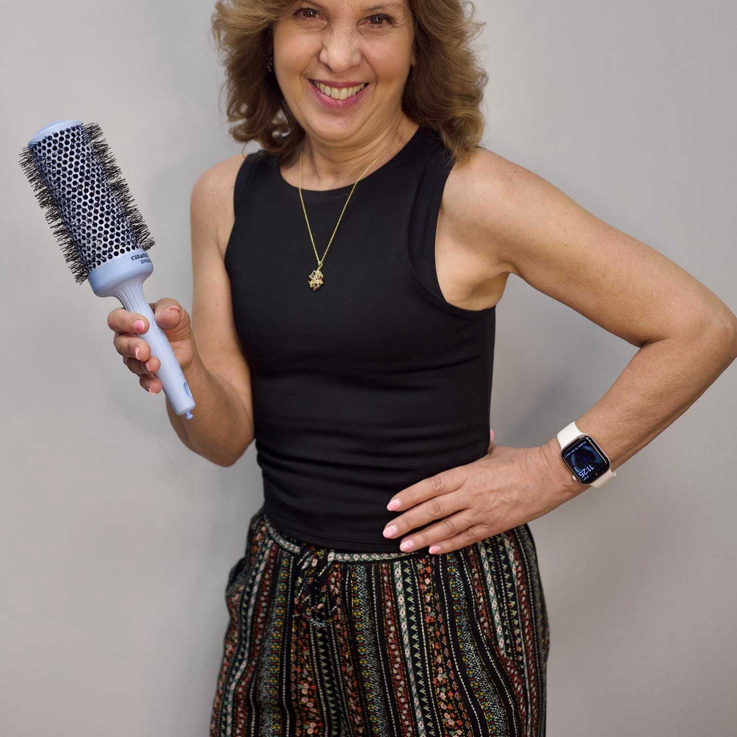 Portrait of Carmen, a professional stylist at Illusions Salon & Spa, showcasing their expertise and style.