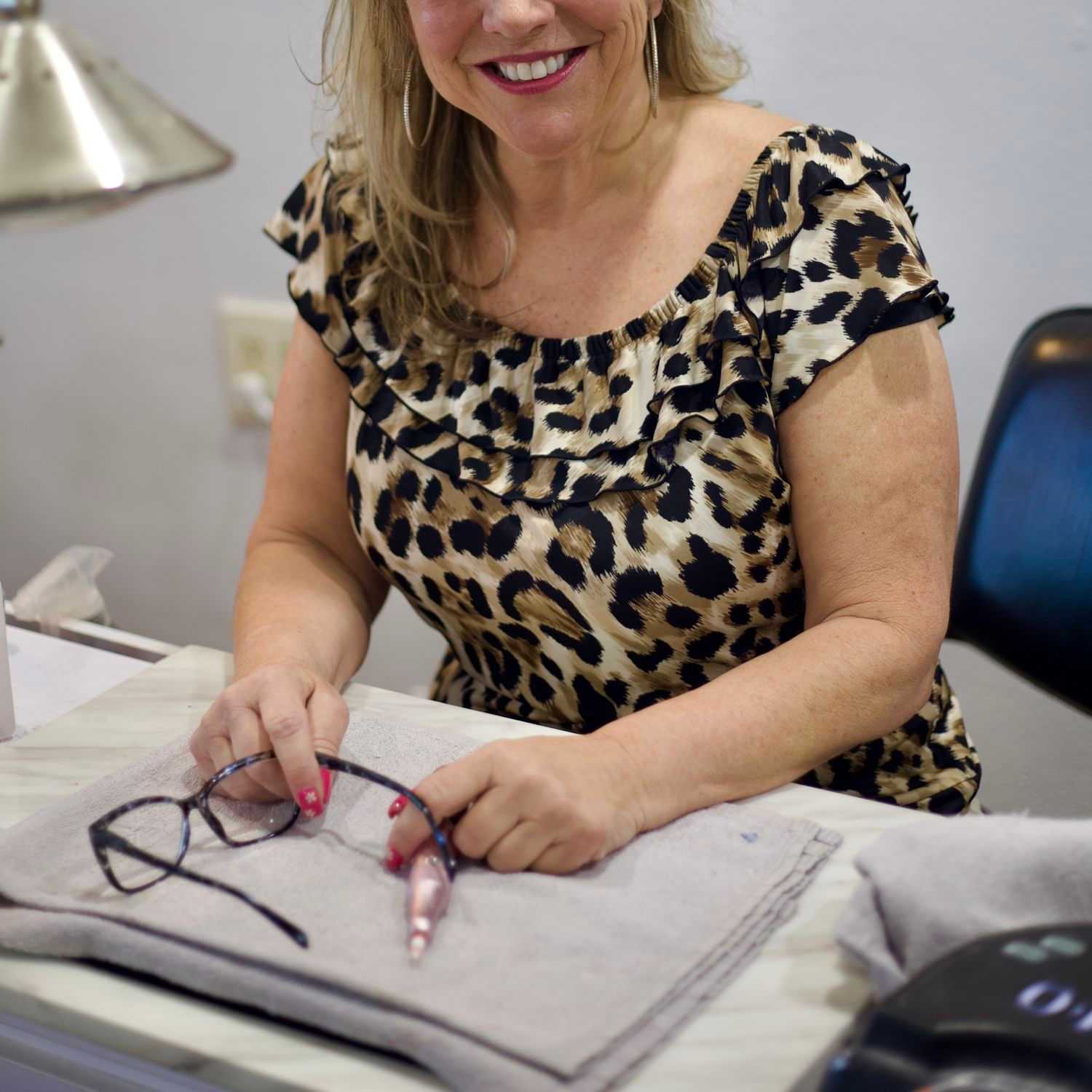 Portrait of Kim, a professional stylist at Illusions Salon & Spa, showcasing their expertise and style.